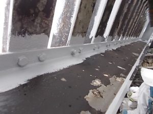 Strip coating with rust mitigating coating